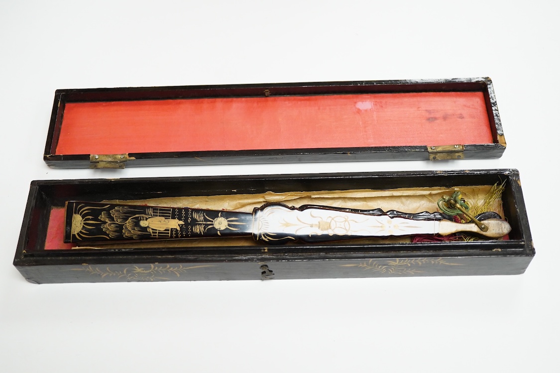 Four 19th century Chinese gilt-decorated black lacquer fans with figure painted leaves, two cased, largest 41cm